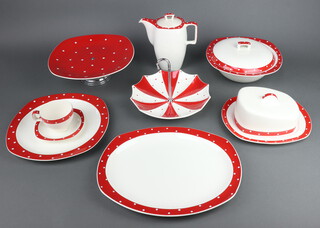 A mid-Century Midwinter Stylecraft Domino tea and dinner service comprising 6 coffee cups (1 a/f), 2 tea cups (1 a/f), 4 large tea cups, 6 small saucers, 3 medium saucers, 2 large saucers, a coffee pot (chipped lid), 2 bowls, 2 small jugs, a preserve pot and lid, 3 egg cups, 2 mustard pots, 2 salts and 2 peppers, 7 side plates, milk jug, 3 sauce boats, dessert bowls, 5 soup bowls (1/af), 2 serving bowls, 2 serving platters, cake stand, 3 tureens and covers, 2 side dishes, 9 large dinner plates, 12 small dinner plates, 5 soup bowls (1 a/f), 4 rectangular dishes, a serving dish, umbrella shaped cake stand, a cheese dish and cover