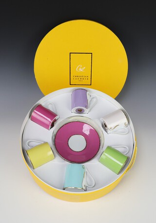 A set of 6 Christian Lacroix Follement coffee cans and saucers, contained in a fitted box 