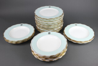 Eighteen Victorian dinner plates with turquoise and gilt rims and monogram, signed by W P and G Phillips together with 12 ditto soup bowls 