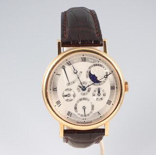 A gentleman's 18ct yellow gold Breguet 944 wristwatch with moon phase aperture and day, date, calendar, and year subsidiary dials, the case numbered 5327 944R with a leather strap and 18ct yellow gold clasp, complete with original walnut mechanical winder and gold screwdriver, warranty certificate, 2 pamphlets and outer box and original invoice 2008