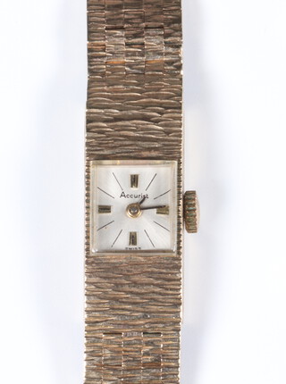 A lady's 9ct yellow gold Accurist wristwatch on a bark finished bracelet, gross weight including glass 26 grams 