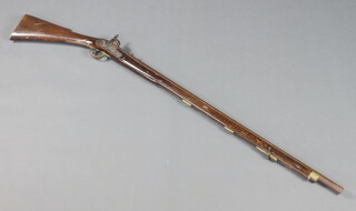 A 19th Century percussion musket, the barrel with crows foot mark and tower lock plate 