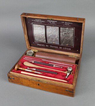 A Dutch 19th Century embossing set, the lid marked Phases Du Travail de L'etain 