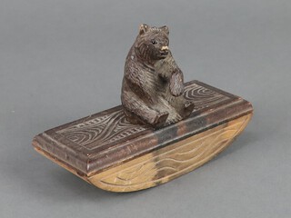 A 19th Century Black Forest carved Swiss blotter surmounted by a figure of a seated bear 10cm x 14cm x 6cm 