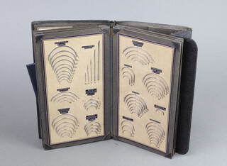 Emanl. Shrimpton and Fletcher, 286 surgical needles contained in a folder, together with 10 Lewis Brothers surgical needles in a folder 