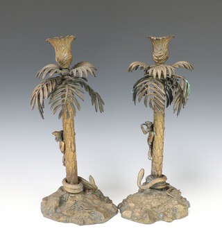 A pair of 19th Century gilt bronze candlesticks in the form of a palm trees with serpents encountering warriors 33cm x 14cm 