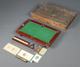 A Nuku miniature billiards table 9cm h x 51cm w x 28cm, complete with 2 sets of rules, 2 brochures, 2 triangles (1 f), spirit level, score board and an associated folding base, all contained within a pine box with hinged lid 