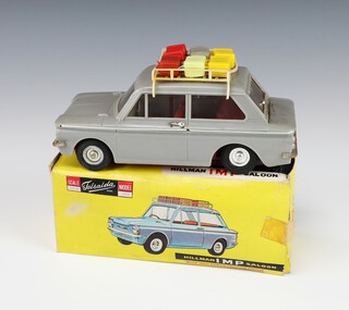 Telsalda, a plastic scale model of a Hillman Imp saloon with friction motor, boxed, complete with roof rack, 6 pieces of luggage and spare tyre 