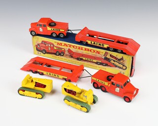 A pair of Matchbox K8 Prime Mover and Transporter with Caterpillar tractors, 1 with fat Laing decals, the other with thin Laing decal, 1 is boxed