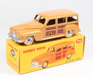 Dinky Toys, a Plymouth estate car no.334, tan body, dark brown panels with spun hubs, boxed 