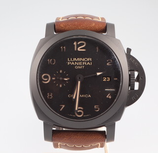 A gentleman's Panerai Luminor GMT Ceramica wristwatch with black face and date aperture and seconds at 9 o'clock on a leather strap with original clasp, the case numbered OP/6883BB1543709 and 00436/1500 together with original box, receipt, certificate, rubber strap, screwdriver, bill of sale 2014, outer box. 