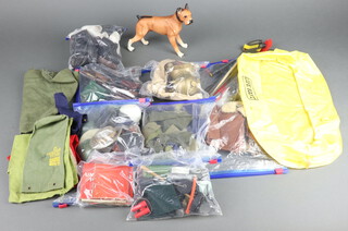 Action Man by Palitoy, a large collection of clothing, accessories and uniforms to include Canadian Royal Mounted Police, Grenadier Guards, Arctic Expedition, Deep Sea Diver, carbines and guns, boxer dog, Shark inflatable dinghy, etc, 