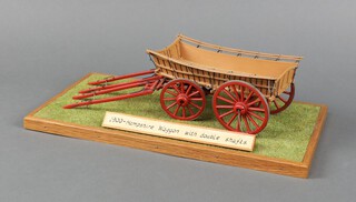 A scratch built 1900 Hampshire wagon displayed on a wooden plinth with grass diorama, the wagon approx. 25cm l x 8cm w, ditto 1893 Devon wagon on a wooden plinth with grass diorama, the wagon 22cm l x 8cm w and ditto 1911 Monmouthshire wagon on a wooden plinth with fence, stone wall and grass diorama, the wagon 22cm l x 7cm w