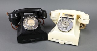 A cream Bakelite dial telephone, the base marked 330L S54/2A, together a black ditto base marked 312L FWR 61/84  