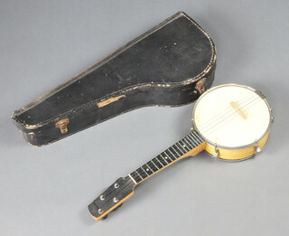 A 4 stringed banjo with 21cm drum, complete with fibre case 