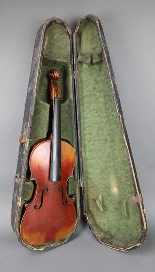 A violin, the interior bearing label marked "Antonius Stradivarius Cremonensis Faciebat Anno 1745", with single piece back, contained in a wooden case