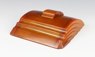 An Art Deco amber coloured crescent shaped Bakelite inkwell complete with well 4cm x 15cm x 17cm 