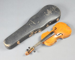 A violin, the interior bearing label marked Copy of Antonius Stradivarius, the 13cm two piece back inlaid mother of pearl, complete with carrying case  