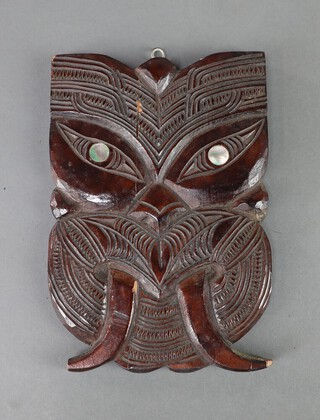 A 20th Century carved hardwood Maori mask set mother of pearl eyes 20cm x 14cm 