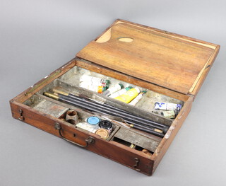 A 19th Century artists box, the hinged lid fitted a rectangular palette, 3 metal trays, various brushes etc 8cm h x 36cm w x 26cm d 