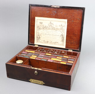 A Victorian mahogany paint box with hinged lid fitted 9 glass bottles (2 have stoppers that are f, all with minor chips) together with 33 various paints, the base fitted a secret drawer 10cm h x 36cm w x 27cm d 