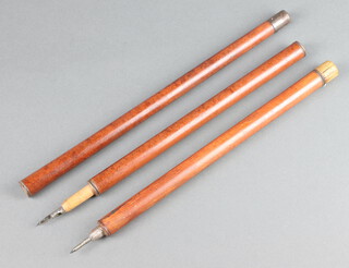 A 19th Century 3 section walking cane, the upper section with ink well and propelling pencil, the middle section fitted a dip pen  