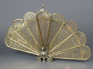 A pierced gilt metal peacock style spark guard 60cm x 89cm 