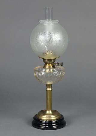 A Victorian glass oil lamp reservoir raised on a gilt metal reeded column, circular ceramic base, complete with chimney and shade 62cm h x 16cm 