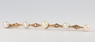 A yellow metal 14k cultured pearl bar brooch, 4.8 grams, 70mm  