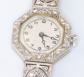 An Art Deco 18ct white gold diamond set cocktail watch with replacement winder on a silk strap 