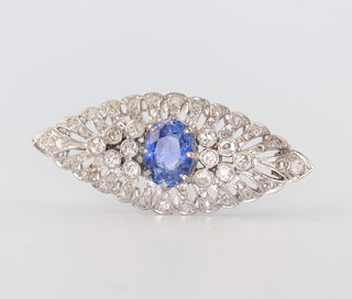 An Art Deco white metal, sapphire and diamond brooch, the centre sapphire approx. 1.5ct, 6.7 grams, 38mm  
