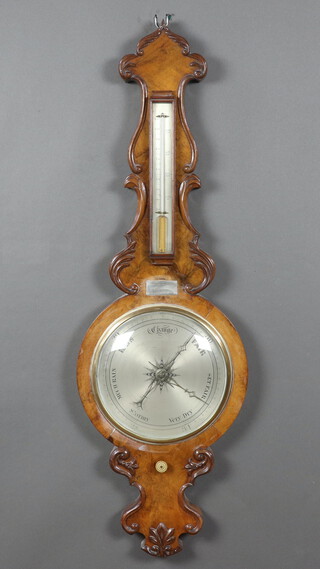A Victorian mercury barometer and thermometer with silvered dial contained in a carved walnut case 104cm h x 33cm w 
