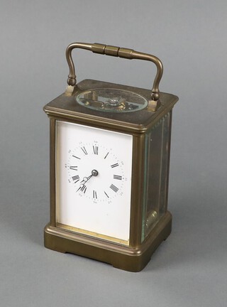 A 19th Century French 8 day carriage timepiece with 7cm enamelled dial contained in a gilt metal case complete with key 13cm h x 9cm w x 8cm d 