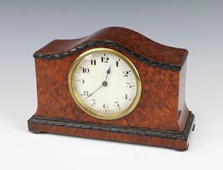 A 1920's bedroom timepiece with 8.5cm paper dial, Arabic numerals, contained in an arch shaped figured walnut case 14cm h x 22cm w x 8cm d 