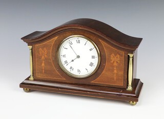 A 1930's bedroom timepiece with 9cm enamelled dial, Roman numerals, contained in an arch shaped inlaid mahogany case on bun feet, 16cm h x 26cm w x 9cm d  