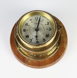A ward room style striking wall clock with 9cm silvered dial, Arabic numerals, contained in a gilt metal case (no key)  