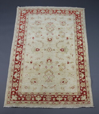A white and brown ground Caucasian style rug  180cm x 124cm