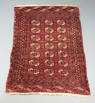 A red and blue ground Bokhara rug with 21 octagons to the centre 150cm x 107cm 