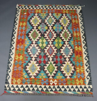 A green, black and yellow ground Chobi kilim rug with all over geometric designs 180cm x 130cm 