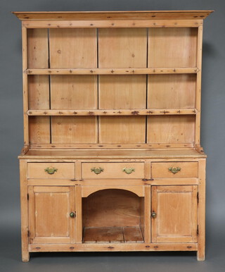 A Victorian pine dog kennel dresser, the raised back with moulded cornice above 2 shelves, the base fitted 1 long and 2 short drawers flanked by cupboards 196cm h x 147cm w x 46cm d 