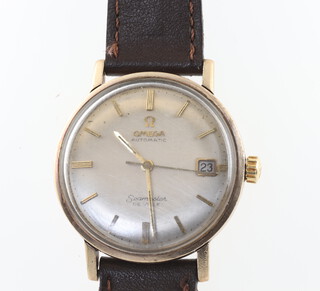 A gentleman's Omega Automatic Seamaster Deville Calendar wristwatch on a leather strap, contained in a 30mm case 