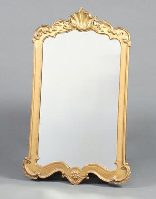 A shaped plate wall mirror contained in a decorative gilt painted frame 81cm x 46cm 