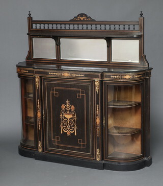 A Victorian ebonised and inlaid walnut D shaped credenza with raised mirrored back, fitted a cupboard enclosed by a panelled door, flanked by bow front cupboards enclosed by panelled doors, raised on a platform base 149cm h x 150cm w x 42cm d 