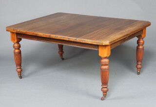 A Victorian walnut extending dining table raised on turned and reeded supports 74cm h x 152cm w x 182cm l 