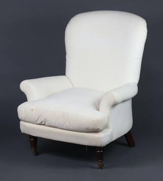 A Victorian style carver chair upholstered in calico, raised on turned supports 101cm h x 80cm w x 60cm d 