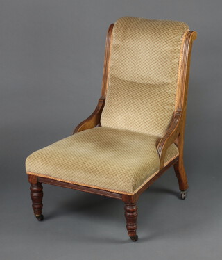 A Victorian mahogany show frame nursing chair upholstered in brown material, raised on turned supports 91cm h x 60cm w x 61cm d 