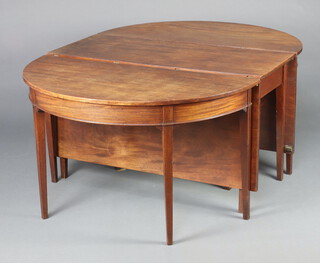 A Georgian mahogany drop flap D end dining table, raised on 14 square tapered supports 71cm h x 122cm w x 277cm when fully extended 