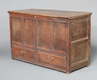 A 17th/18th Century oak mule chest with iron butterfly hinges, the interior fitted a candlebox, the base fitted 2 long drawers with brass swan neck drop handles 84cm h x 137cm w x 56cm d 