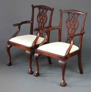 A pair of Chippendale style mahogany slat back open arm carver chairs with upholstered drop in seats, raised on cabriole supports 96cm h x 55cm w x 52cm d 