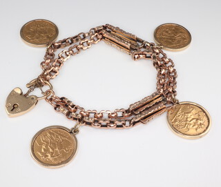 A yellow metal bracelet with a 9ct padlock and 4 half sovereigns - 1909, 1913, 1914 and 1925 in yellow metal mounts, gross weight 39.2 grams 